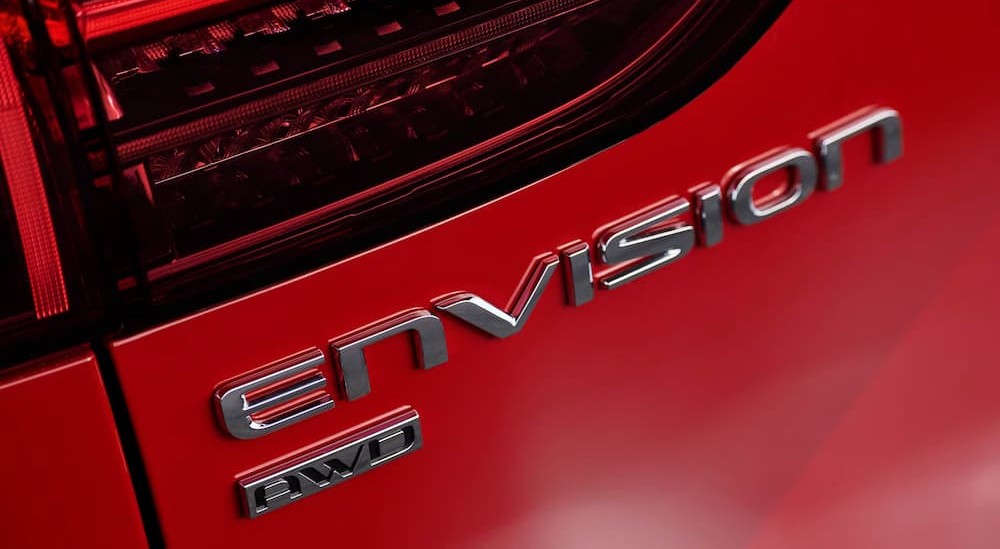 Close-up of the badge on a red 2026 Buick Envision.