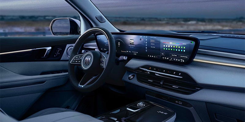View of the Front Interior of a 2025 Buick Enclave Under the Evening Sky
