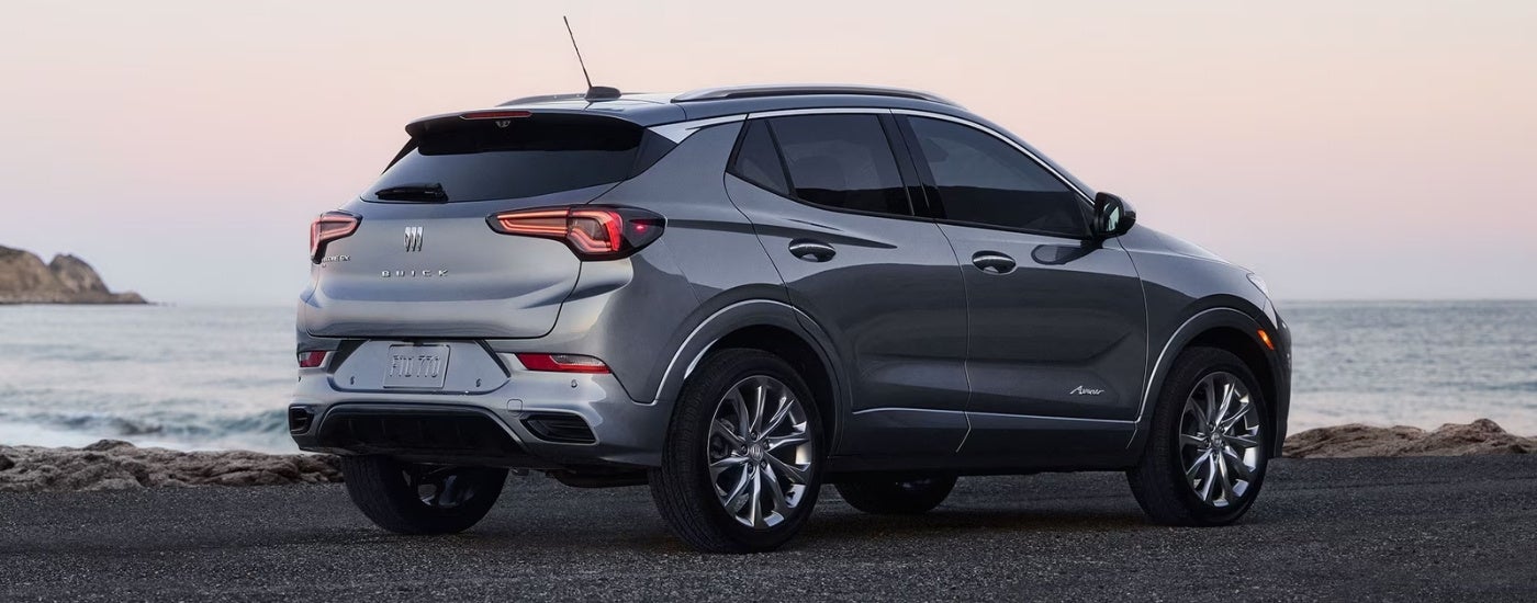 A silver 2025 Buick Encore GX for sale from the rear at an angle.