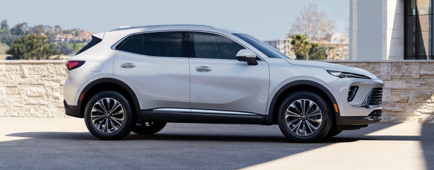 A white 2024 Buick Envision for sale parked on pavement.