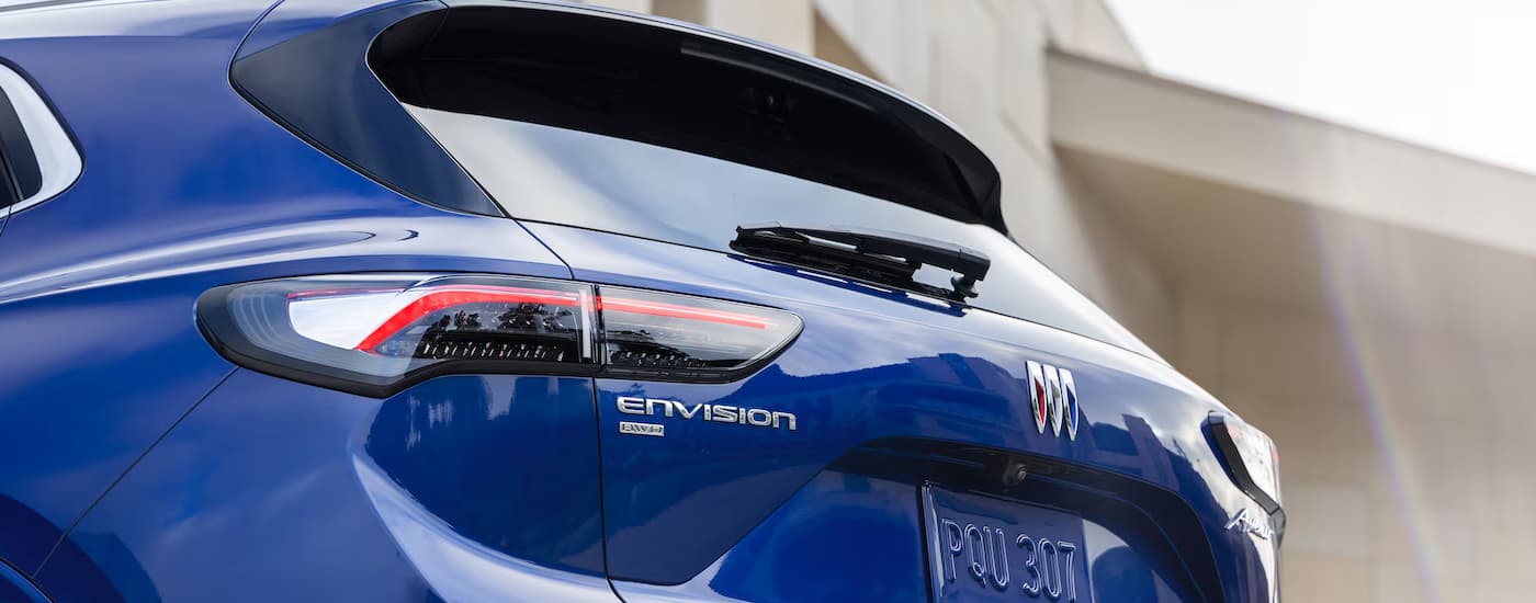 Rear of a blue 2025 Buick Envision for sale near Garland at a dealership