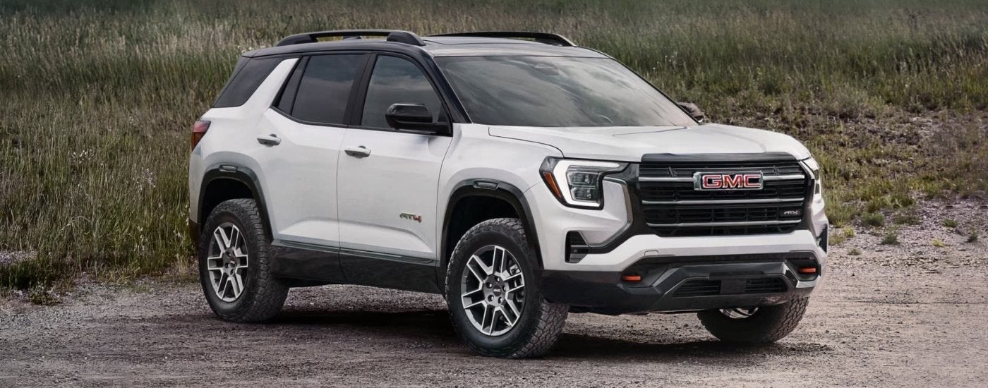 A white 2025 GMC Terrain AT4 is parked on sand lot after leaving a GMC dealer near Wylie.