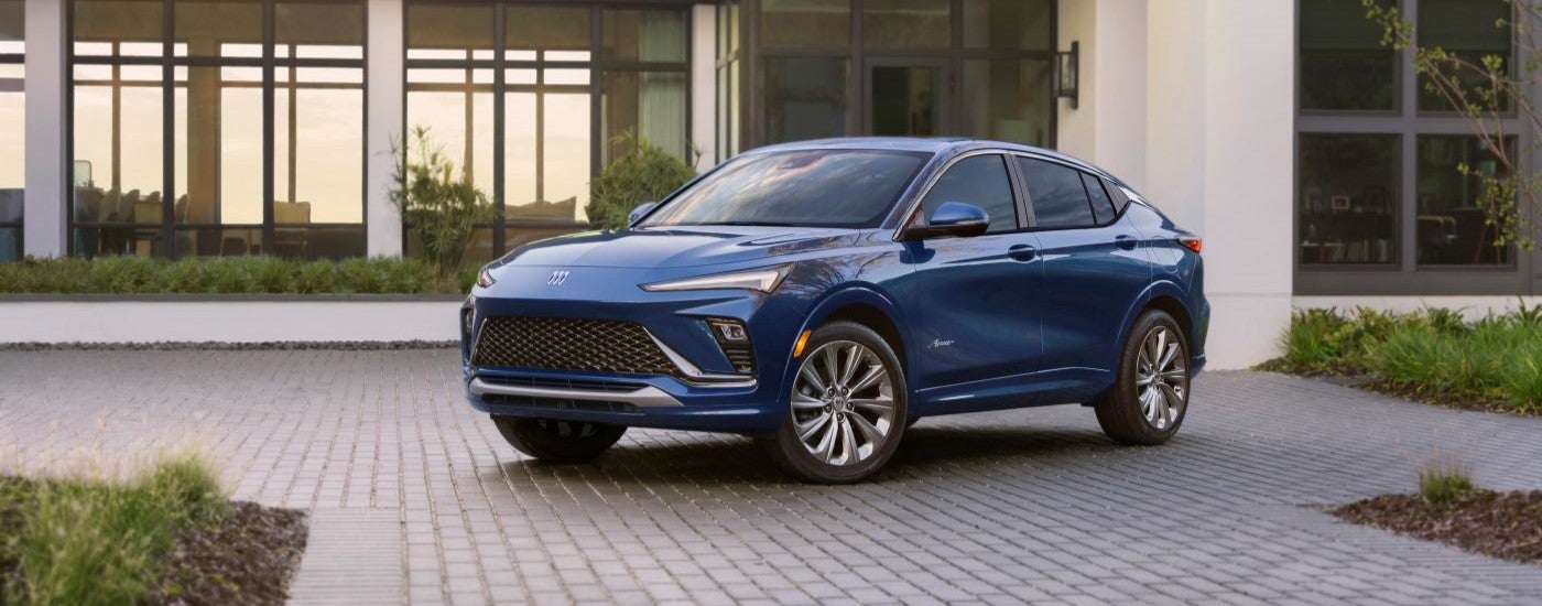 A blue 2024 Buick Envista Avenir parked in a driveway